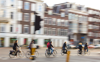 Cyclists Crossing ~ Bicycling picture from Amsterdam Netherlands.